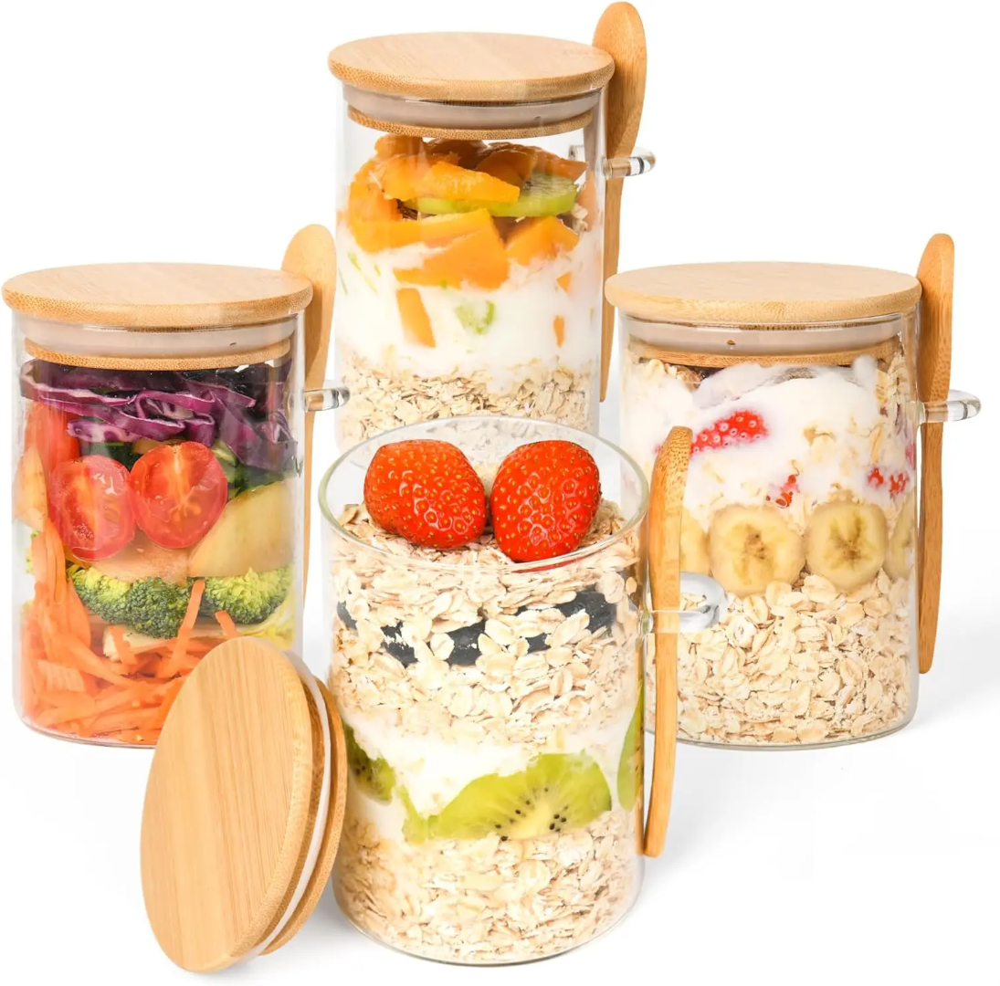 Set of glass jars with wooden lids containing layered food items on a white background