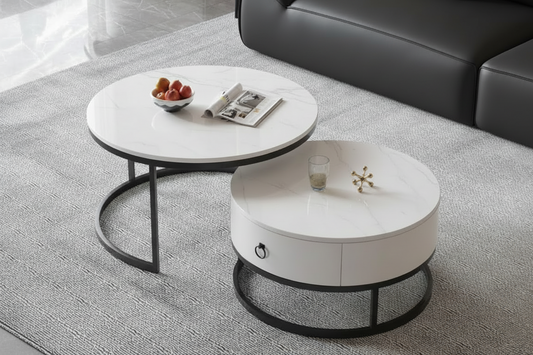 Two white coffee tables with black metal legs on a gray carpeted floor.