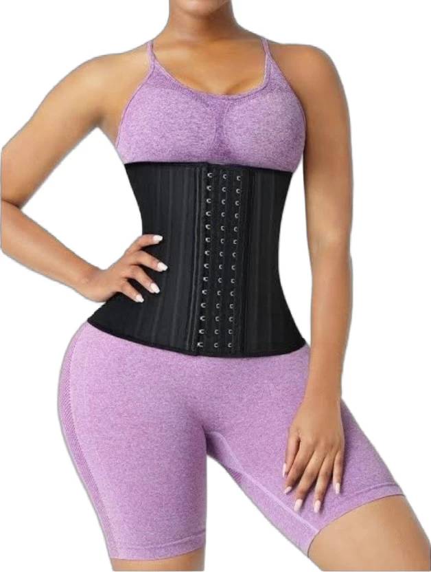 Person wearing a black waist trainer with purple athletic wear on a white background