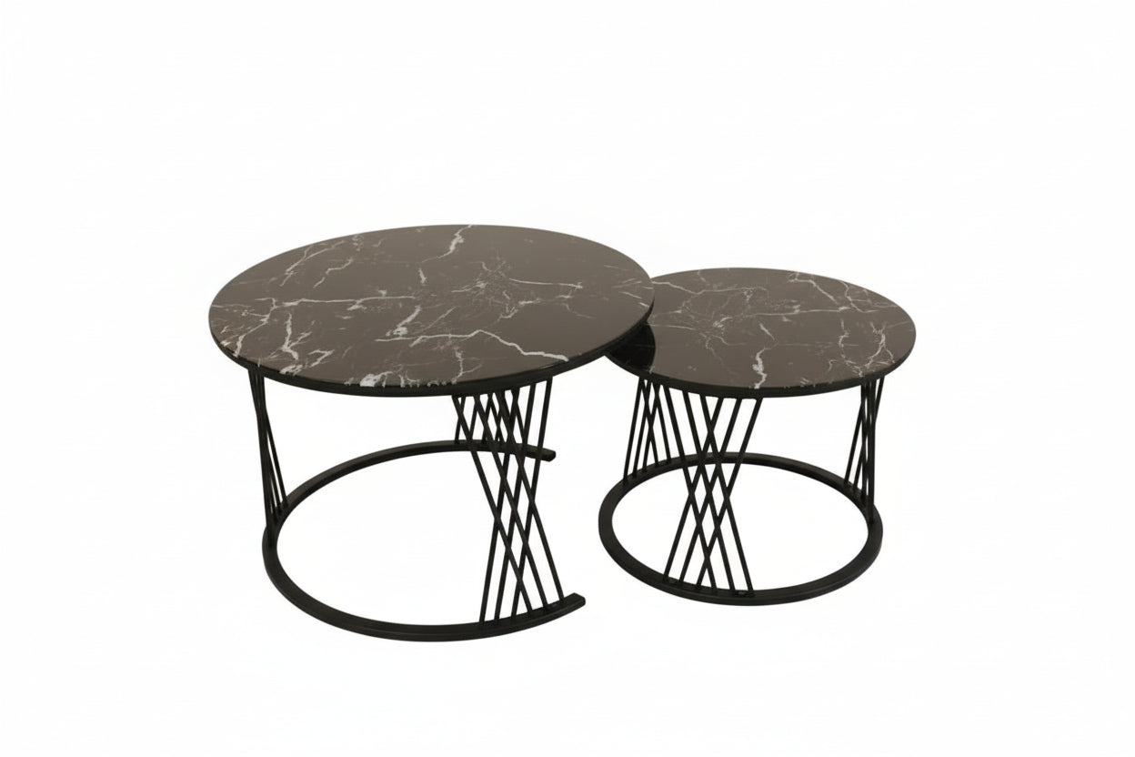 Two black marble coffee tables with decorative items on a tiled floor.