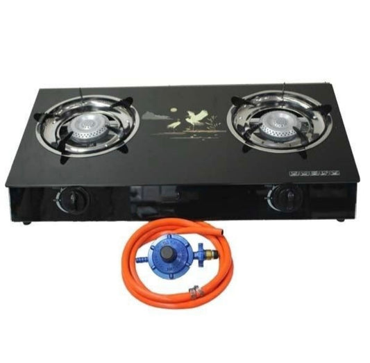 Two-burner gas stove with a gas hose on a white background