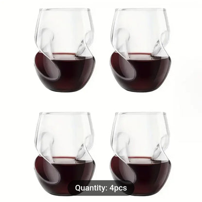 Four stemless wine glasses filled with red wine on a white background