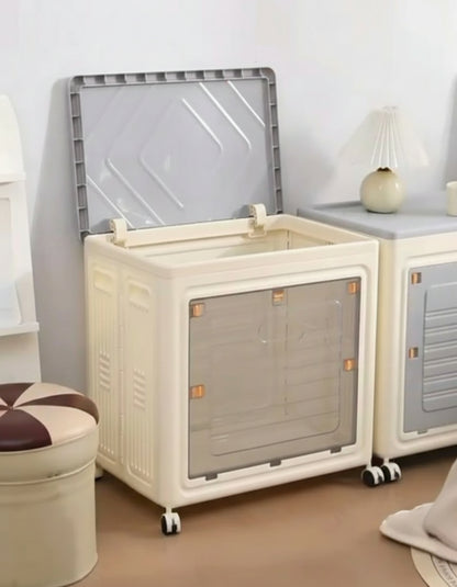 White pet crate with transparent door on wheels in a room setting.