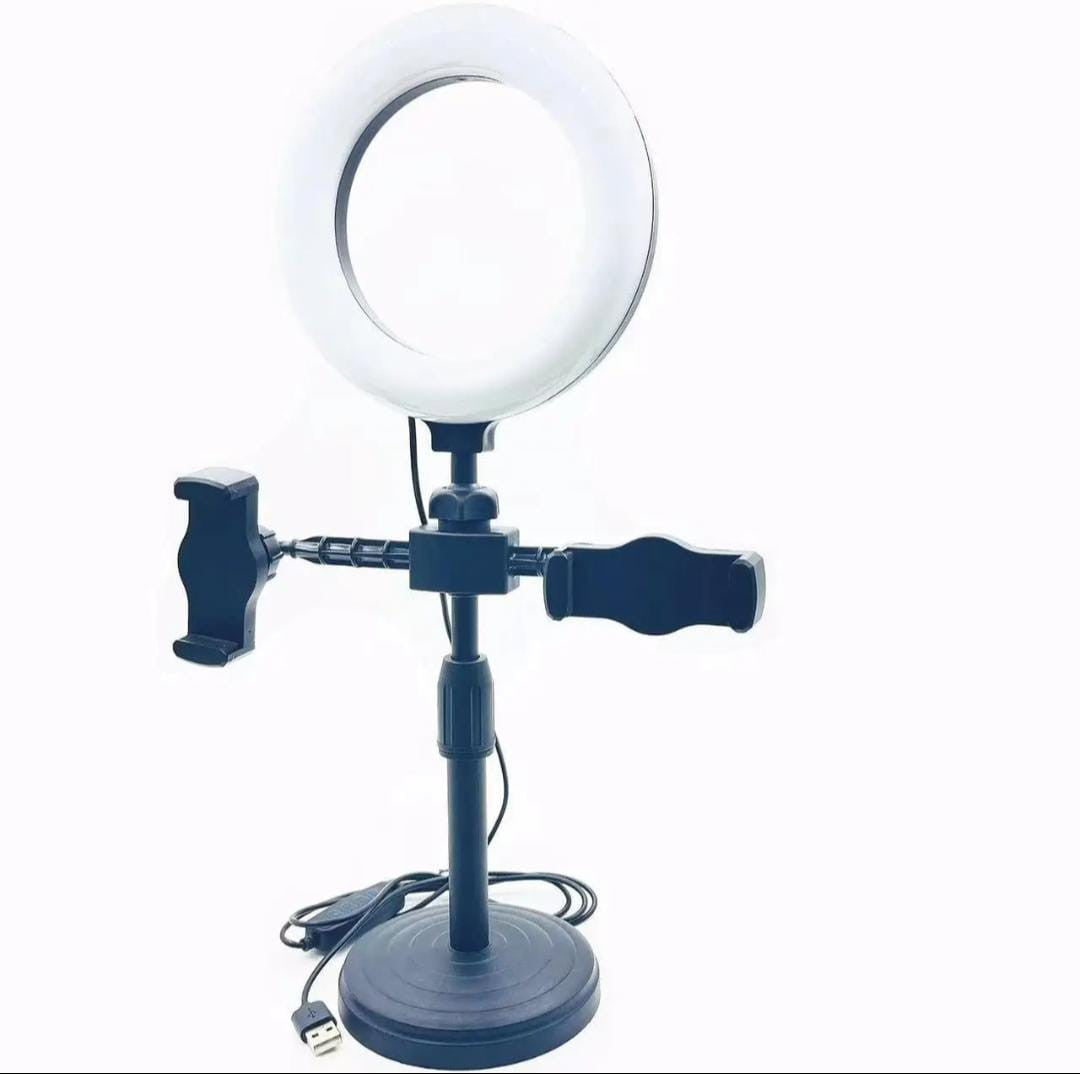 Ring light with stand and phone holder on a white background