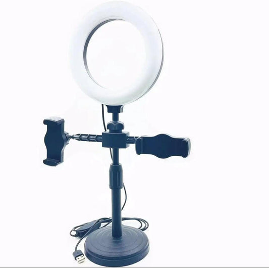 Ring light with stand and phone holder on a white background