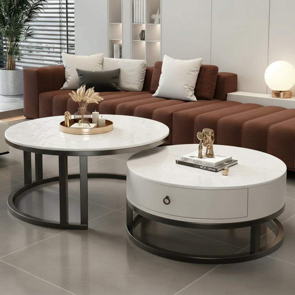 Modern living room with brown sofa, white coffee tables, and decorative items.