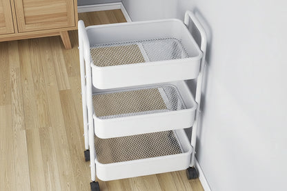 White rolling cart with mesh baskets on a wooden floor.