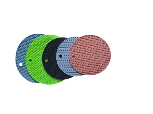 Set of five circular sanding pads in blue, green, black, gray, and pink on a white background.