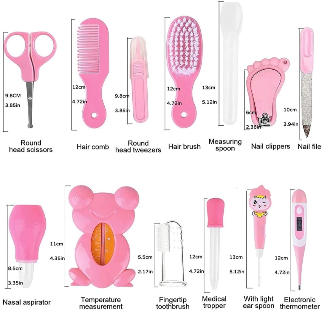 A set of pink baby and toddler grooming tools with detailed measurements and labels, including round head scissors, hair comb, hair brush, measuring spoon, nail clippers, nail file, nasal aspirator, temperature thermometer, fingertip toothbrush, medical trooper, and electronic thermometer.