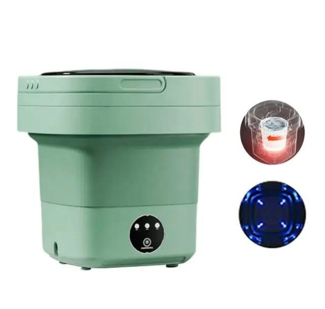 A compact, foldable washing machine in sage green, shown with two circular inset diagrams on the right: one illustrating a light source inside a clear cup, and another showing blue LED light emission.
