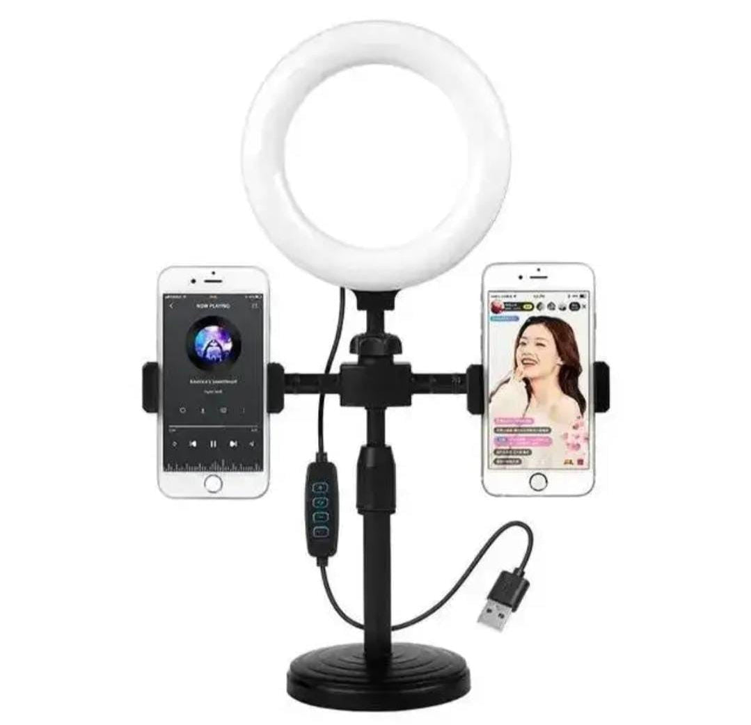 Ring light with smartphone holder and two phones displaying different apps on a white background