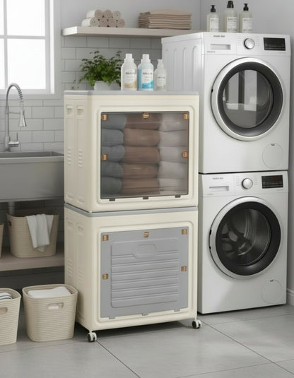 Storage cabinet with transparent door showing folded clothes next to a bed in a bedroom.